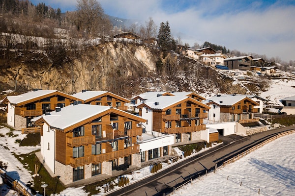 Foto van Luxe chalet met sauna bij het zwemmeer - Vakantiehuis in Uttendorf - ExteriorWinter
