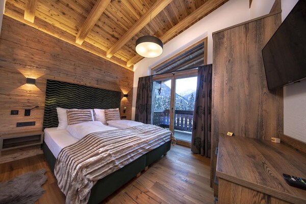 Foto van Chalet Retreat nabij de Kitzbüheler Alpen - Vakantiehuis in Neukirchen - BedRoom