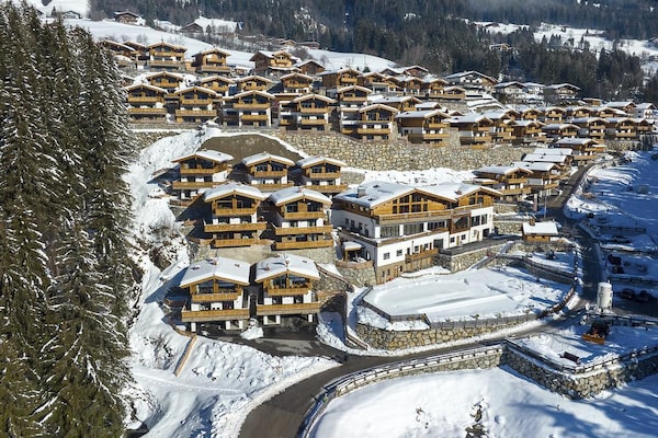 Foto van Chalet Retreat nabij de Kitzbüheler Alpen - Vakantiehuis in Neukirchen - ExteriorWinter