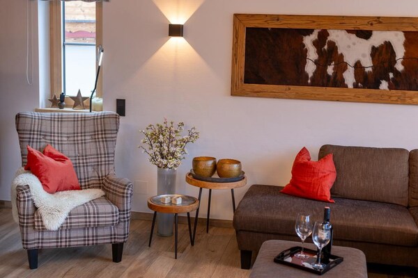 Foto van Chalet in Neukirchen met sauna en balkon - Vakantiehuis in Neukirchen - LivingRoom