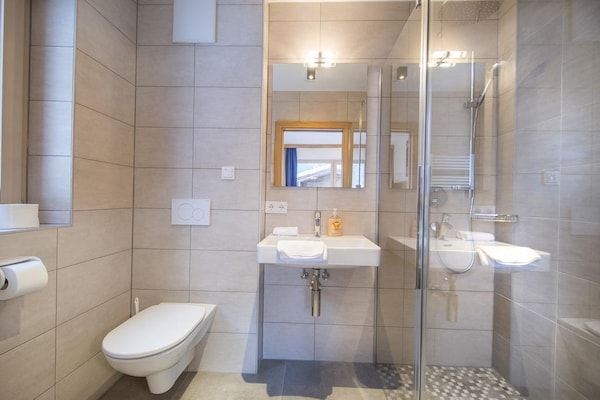 Foto van Chalet met sauna vlakbij de skibus - Vakantiehuis in Neukirchen - BathRoom