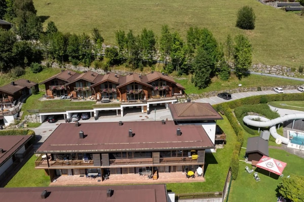 Foto van Schilderachtig Alpenchalet in Wald im Pinzgau - Vakantiehuis in Wald-Königsleiten - ExteriorSummer