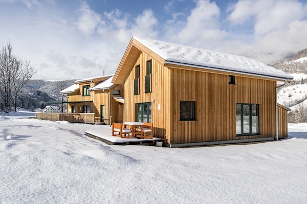 Foto van Luxe chalet in Sankt Georgen met jacuzzi - Vakantiehuis in Sankt Georgen am Kresichberg - ExteriorWinter