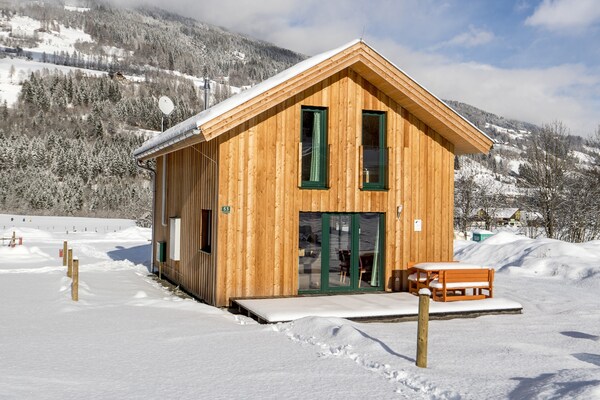 Foto van Luxe chalet in Sankt Georgen met jacuzzi - Vakantiehuis in Sankt Georgen am Kresichberg - ExteriorWinter