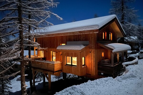 Foto van Luxe chalet met buitenwhirlpool - Vakantiehuis in Turracherhöhe - ExteriorWinter