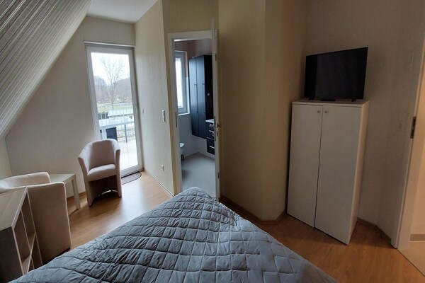 Foto van Vakantieappartement met uitzicht op het meer aan de Groß Labenzer See - BedRoom