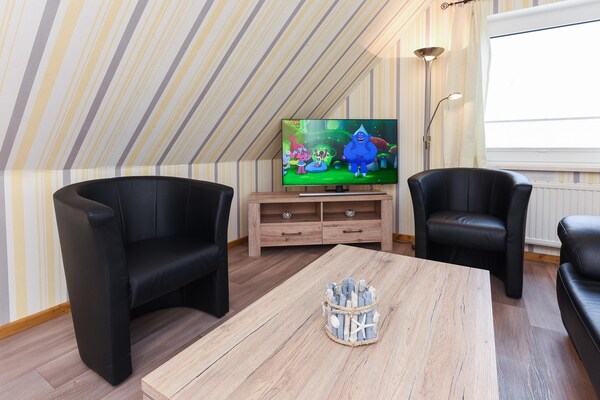 Foto van Groot vakantieappartement op de zolder, Bensersiel - LivingRoom