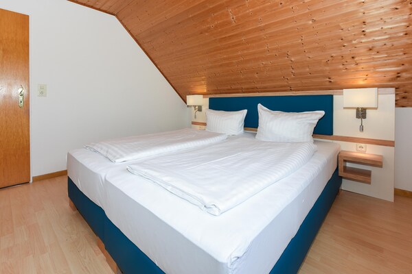 Foto van Groot vakantieappartement op de zolder, Bensersiel - BedRoom