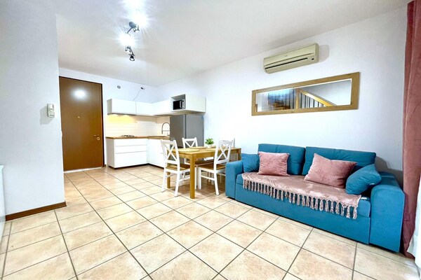 Foto van Prachtig resort in Caorle vlakbij het strand - Vakantiehuis in Caorle (VE) - LivingRoom