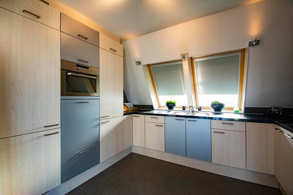 Foto van Penthouse Duinerei aan zee met sauna - Vakantiehuis in Groote Keeten - Kitchen