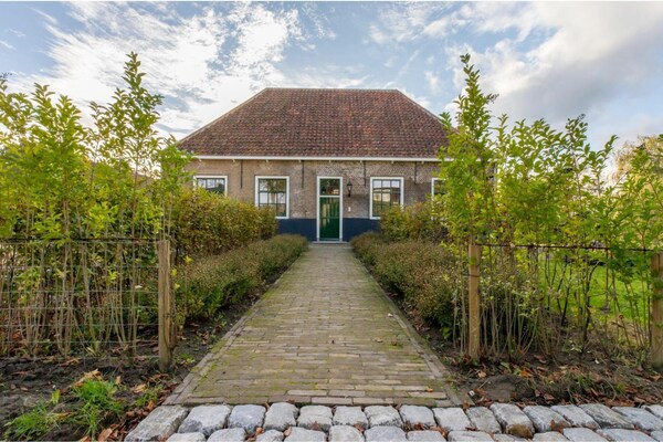 Foto van Boerderij in Zeeland met molenuitzicht - Vakantiehuis in Heinkenszand - ExteriorSummer
