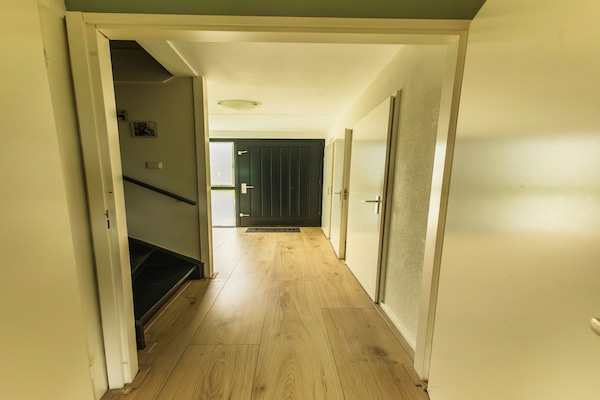 Foto van Gezellig vakantiehuis met tuin - Vakantiehuis in Ewijk - Landing