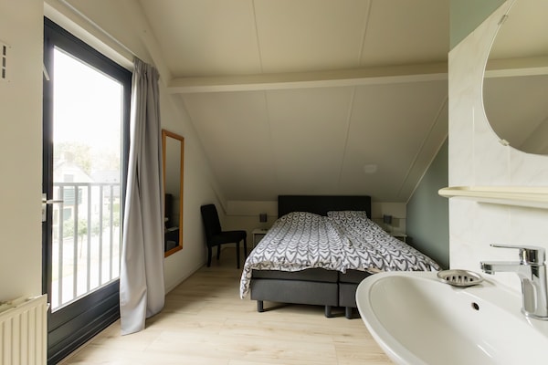 Foto van Gezellig vakantiehuis met tuin - Vakantiehuis in Ewijk - BedRoom