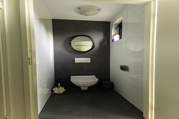 Foto van Gezellig vakantiehuis met tuin - Vakantiehuis in Ewijk - BathRoom