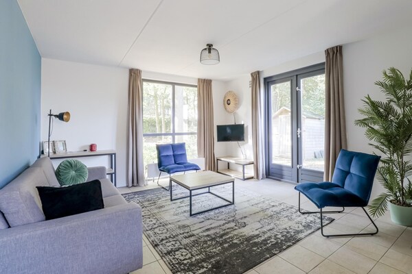 Foto van Rustige bosbungalow voor 6 personen - Vakantiehuis in Ewijk - LivingRoom