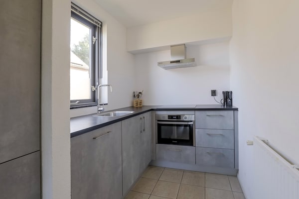 Foto van Rustige bosbungalow voor 6 personen - Vakantiehuis in Ewijk - Kitchen