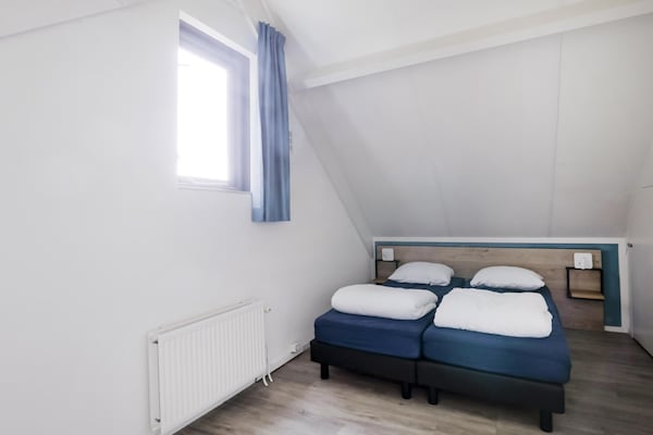 Foto van Rustige bosbungalow voor 6 personen - Vakantiehuis in Ewijk - BedRoom