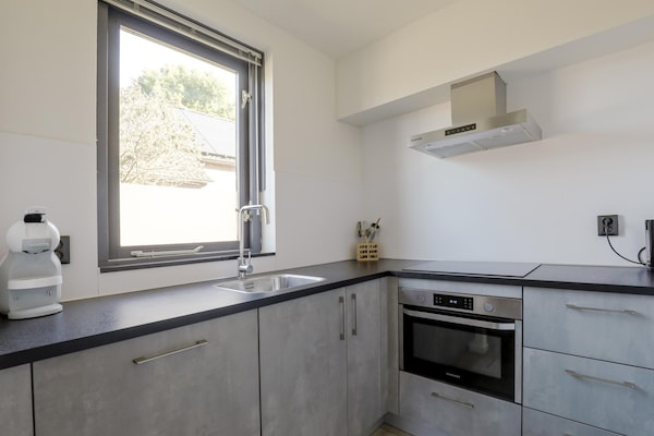 Foto van Rustige bosbungalow voor 6 personen - Vakantiehuis in Ewijk - Kitchen