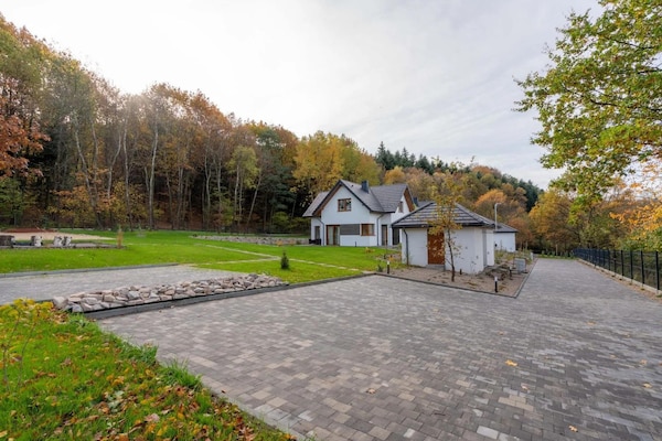 Foto van Comfortabele vakantievilla met sauna en jacuzzi - Vakantiehuis in Marcyporeba - ExteriorSummer