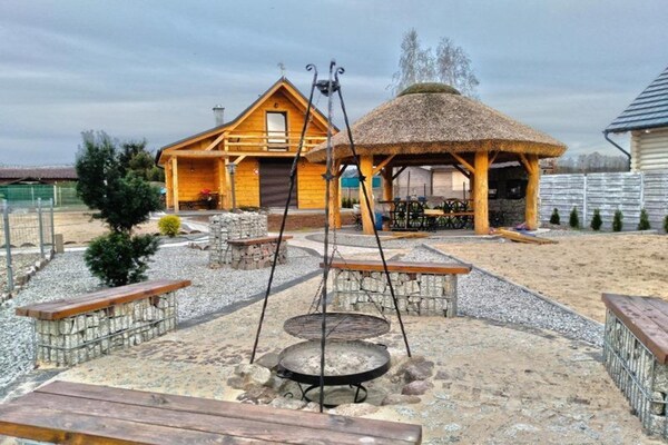 Foto van Comfortabele vakantiehuizen met open haard - Vakantiehuis in Lubrza - TerraceBalcony