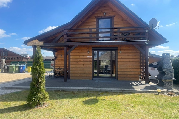 Foto van Comfortabele vakantiehuizen met open haard - Vakantiehuis in Lubrza - ExteriorSummer