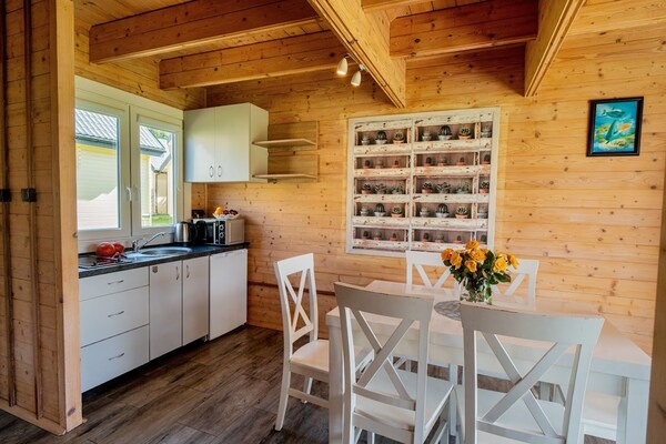 Foto van Comfortabele vakantiehuizen met zwembad - Vakantiehuis in Ustronie Morskie - LivingRoom